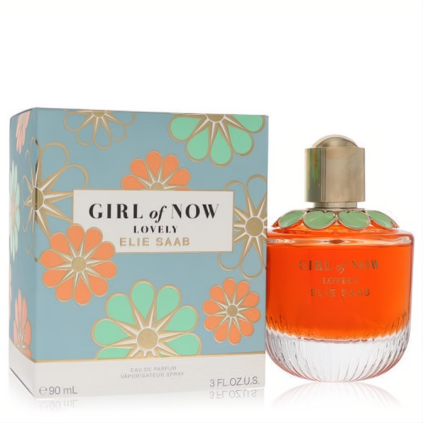 Elie Saab Girl of Now Lovely 3 oz EDP. Vibrant orange perfume bottle with green floral collar, beside its elegant blue and gold floral box.
