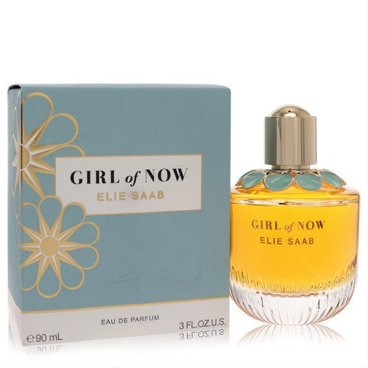 Exquisite Elie Saab Girl of Now 3 oz EDP spray. Golden amber perfume bottle with unique blue floral cap, beside its elegant blue and gold box.