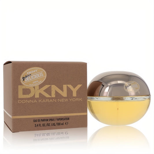 Radiant DKNY Golden Delicious 3.4 oz Eau De Parfum. Golden apple-shaped bottle with metallic cap, beside its chic brown box.