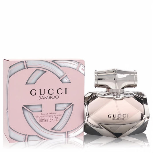 Luxurious Gucci Bamboo 1.6 oz Eau De Parfum spray. Features a faceted glass bottle with a unique silver bamboo cap and iconic pink box.