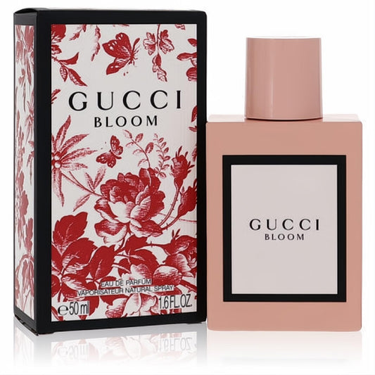 Iconic Gucci Bloom 1.6 oz Eau De Parfum in a sleek pale pink bottle, with its vibrant red floral box.
