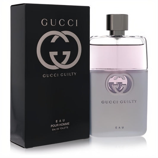 Gucci Guilty Eau de Toilette for men. Elegant black box and frosted grey bottle with a silver cap, iconic GG logo, and pinkish liquid.