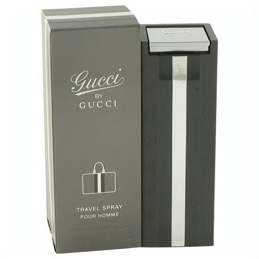 Gucci by Gucci 1 oz men's EDT travel spray. Sleek dark gray bottle with a bold silver stripe and branded box.