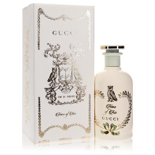 Elegant Gucci Tears of Iris perfume spray. Cream bottle with gold owl art, ornate cap, and decorative matching box.