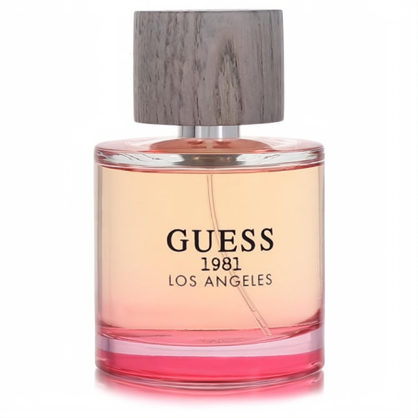 Guess 1981 Los Angeles 3.4 oz EDT spray. Elegant clear glass bottle with vibrant ombre peach-pink fragrance and a stylish wood-grain cap.