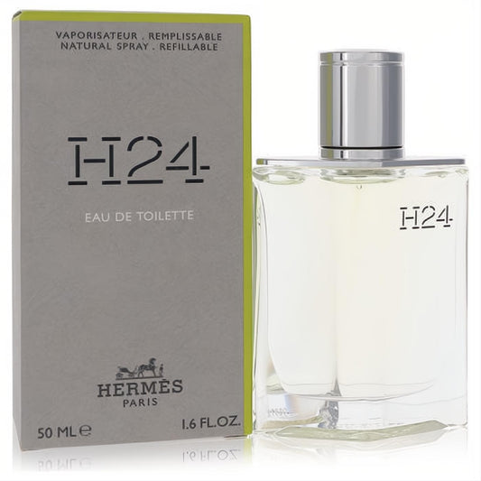 Hermes H24 men's 1.6 oz refillable Eau De Toilette. Sleek clear glass bottle, silver cap, and modern grey box with green accent.