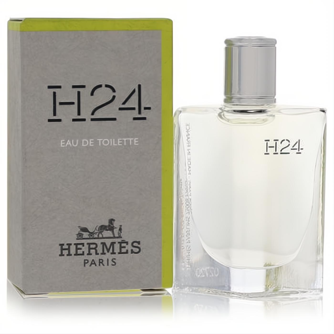 Luxury Hermes H24 Mini EDT .17 oz men's fragrance: clear glass bottle with silver cap next to its modern gray and lime green box.