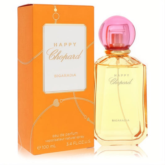 Captivating Chopard Happy Bigaradia 3.4 oz Eau De Parfum spray. Vibrant orange box, elegant clear bottle with yellow liquid and pink cap.