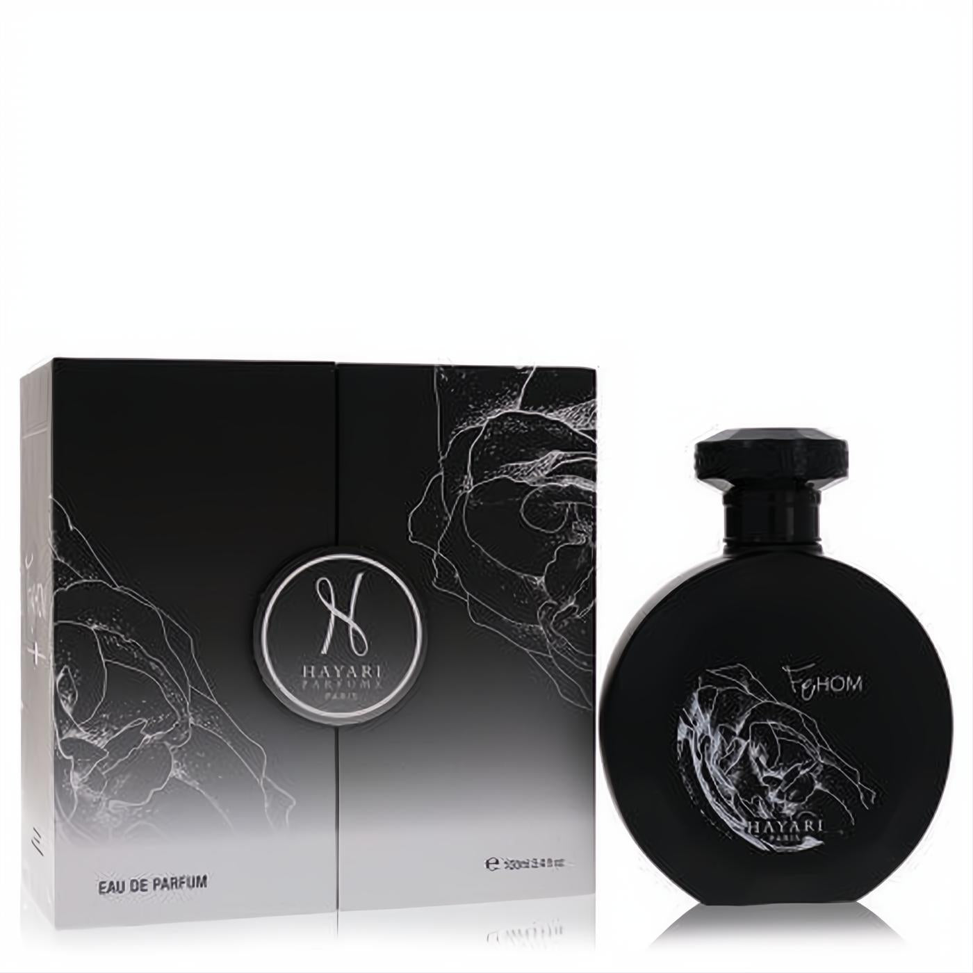 Hayari Fehom unisex Eau de Parfum: sleek black round bottle with white floral design, next to its elegant matching box.