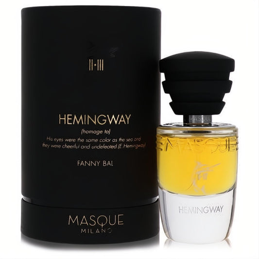 Masque Milano Hemingway unisex EDP: striking bottle with vibrant yellow liquid, black tiered cap, and elegant matte black cylindrical box.