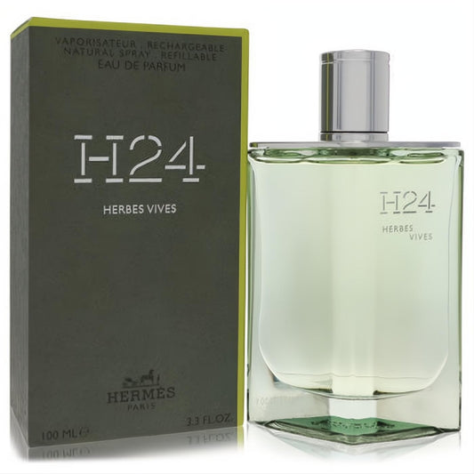 Hermes H24 Herbes Vives 3.4 oz refillable EDP. Sleek clear glass bottle with fresh green fragrance, silver cap, and matching olive box.