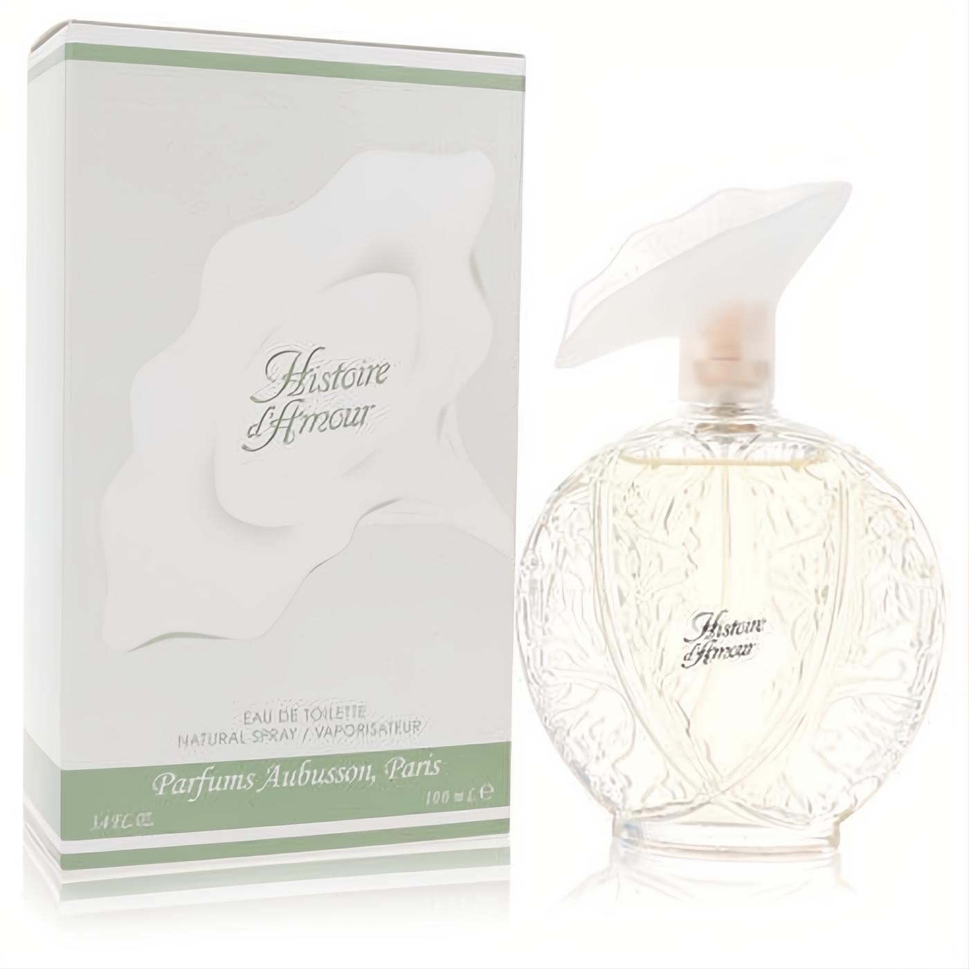 Histoire D'Amour Aubusson 3.4 oz EDT. Elegant clear floral bottle with a unique leaf cap, next to its white and green box.