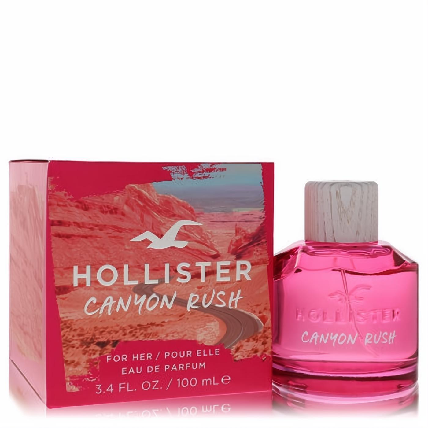 Unleash adventure with Hollister Canyon Rush 3.4 oz EDP. Vibrant pink bottle, wood-grain cap, and stunning desert box.