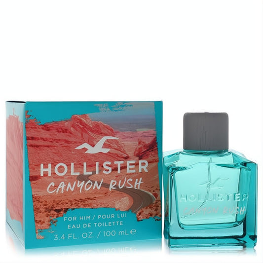 Vibrant teal glass Hollister Canyon Rush 3.4 oz EDT spray bottle with grey cap, next to its rugged canyon-themed box.