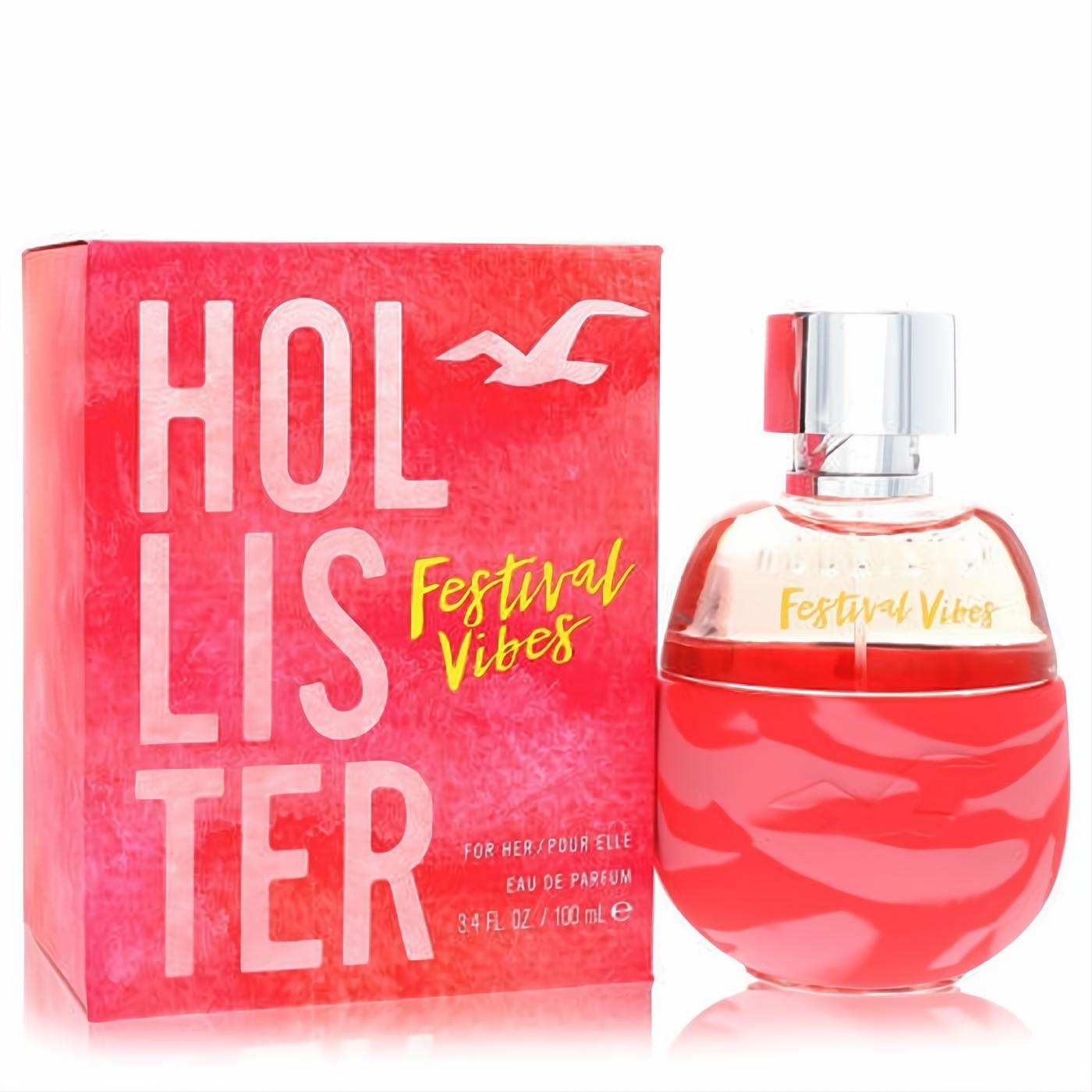 Hollister Festival Vibes 3.4 oz women's EDP. Bright coral pink bottle with unique wavy design, matching vibrant box.