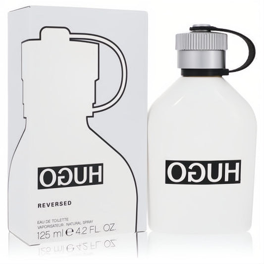 Hugo Reversed 4.2 oz men's EDT spray. Sleek white bottle with a silver cap, black strap, and matching minimalist box.