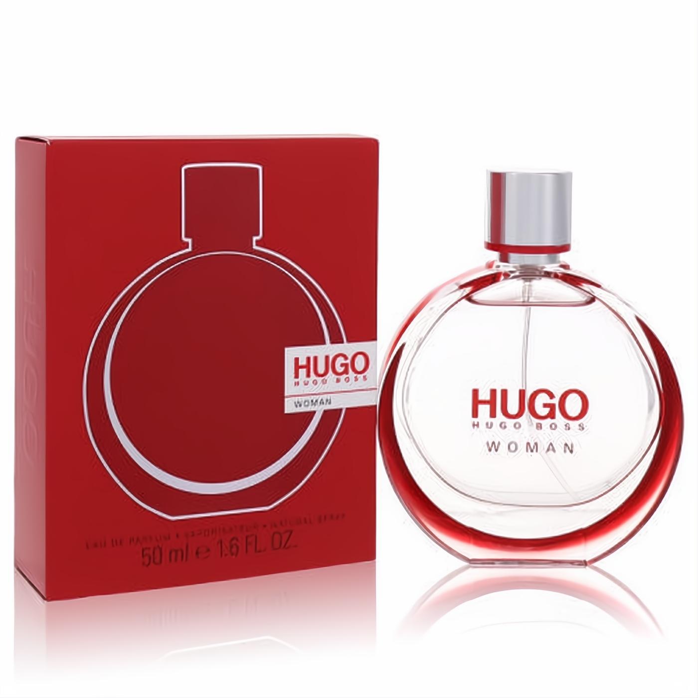 Discover Hugo Boss Woman 1.6 oz Eau De Parfum. Iconic clear circular bottle with red details, sleek silver cap, and bold red box.