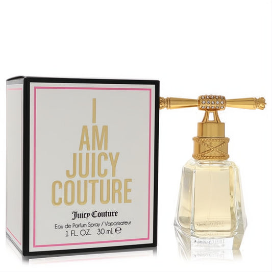I Am Juicy Couture 1 oz EDP spray. Clear faceted glass bottle with a dazzling gold jeweled cap, next to its chic white and gold box.
