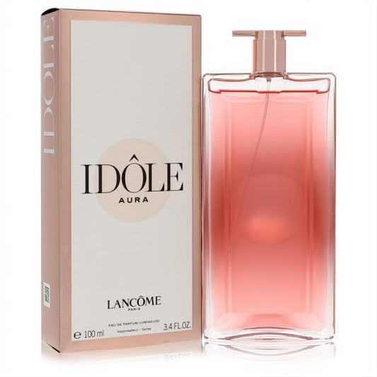Experience Lancome Idole Aura 3.4 oz: sleek glass bottle with radiant pink fragrance, elegant rose gold details, next to its luxurious box.
