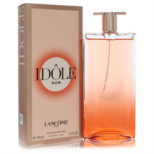 Elevate your scent with Lancome Idole Now 1.7 oz EDP. Features a sleek, vibrant orange gradient glass bottle and elegant peach box.