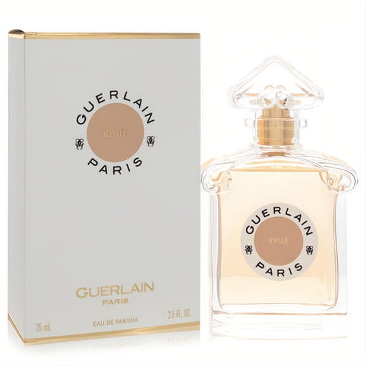 Guerlain Idylle 2.5 oz Eau De Parfum. Elegant clear glass bottle with golden liquid, faceted cap, and luxurious white & gold box.