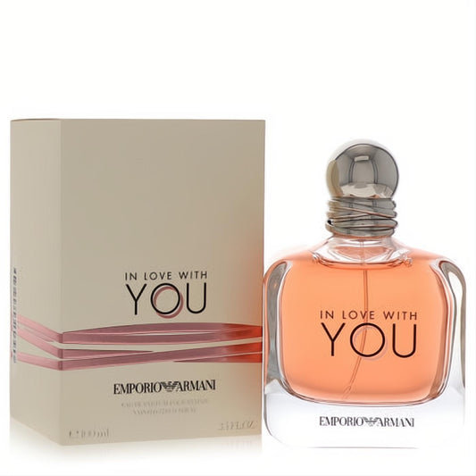 Giorgio Armani In Love With You 3.4 oz EDP. Elegant clear bottle with romantic pink fragrance, sleek silver cap, and matching beige box.