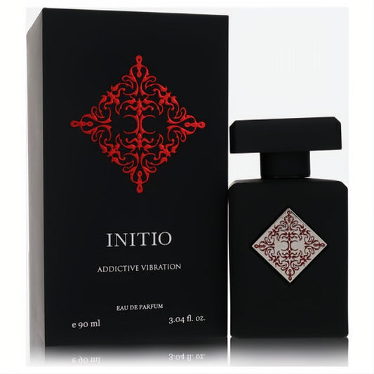 Elegant Initio Addictive Vibration 3.04 oz Eau De Parfum. Matte black bottle and box with a striking red emblem, a captivating unisex fragrance.