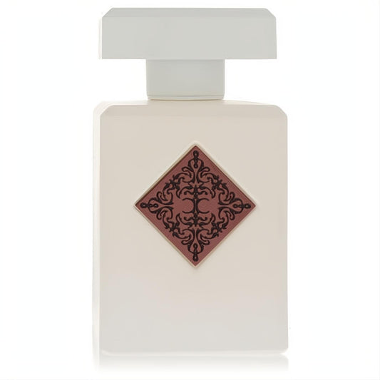 Initio Paragon 3.04 oz unisex fragrance: sleek white bottle with a distinctive reddish-brown diamond emblem and black scrollwork.