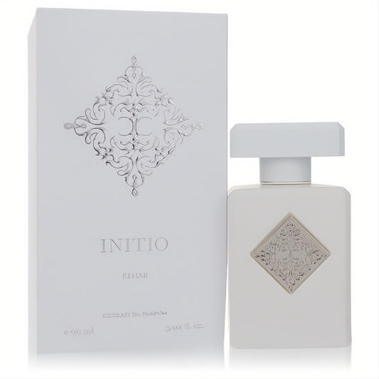Elegant Initio Rehab 3.04 oz unisex Extrait De Parfum. Matte white bottle with a silver ornate emblem and matching box.
