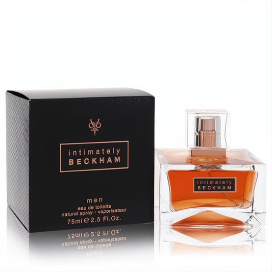 Intimately Beckham men's 2.5 oz Eau De Toilette. Amber fragrance in a sleek clear glass bottle with rose gold cap, next to its black box.
