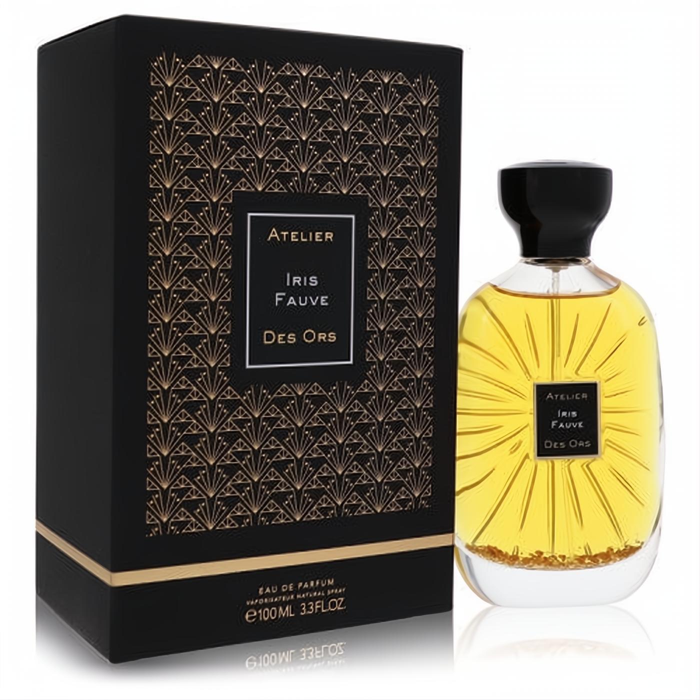 Experience Iris Fauve 3.3oz unisex EDP. Golden liquid with shimmering flakes in a clear, sunburst bottle, beside its elegant Art Deco black box.