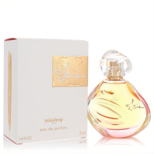 Luxurious Sisley Izia 1.6 oz EDP. Features an elegant teardrop bottle with golden liquid, sculptural cap, and a chic white box with gold accents.