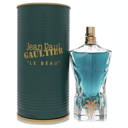 Jean Paul Gaultier Le Beau 2.5 oz men's cologne: striking blue torso bottle with gold leaf detail next to its ribbed teal tin.