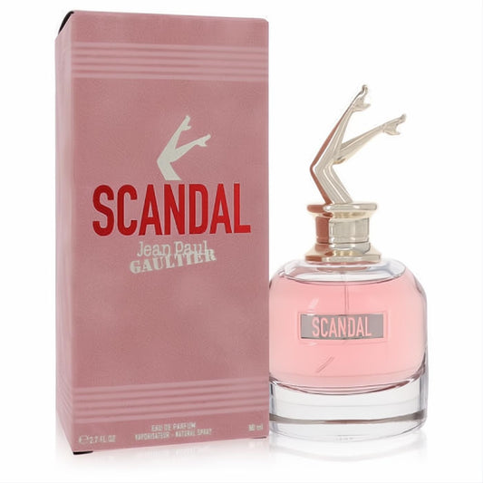 Jean Paul Gaultier Scandal 2.7 oz Eau De Parfum. Features a pink box and an elegant glass bottle with an iconic sculpted leg cap.