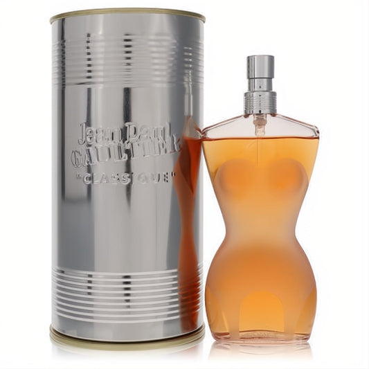 Captivating Jean Paul Gaultier Classique 3.4 oz EDT in an iconic amber female torso bottle, beside its ribbed silver tin.
