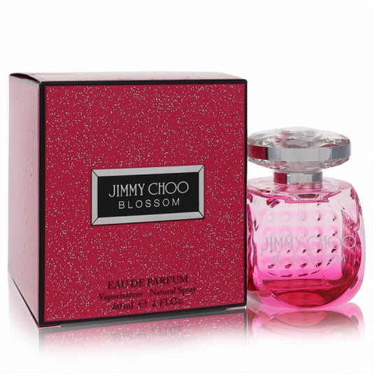 Jimmy Choo Blossom 2 oz women's Eau De Parfum. Dazzling pink faceted bottle with clear cap, beside a vibrant fuchsia sparkling box.