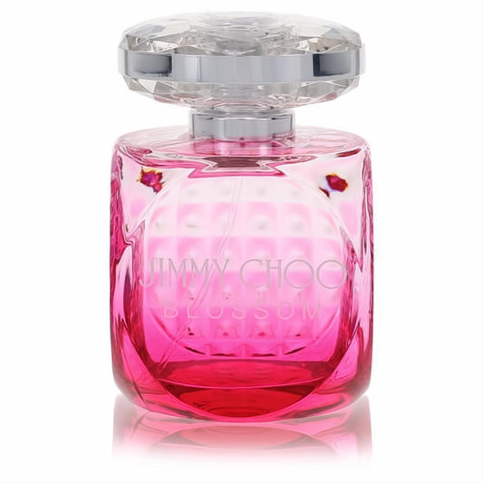 Stunning Jimmy Choo Blossom Eau De Parfum in a vibrant pink glass bottle with a luxurious faceted crystal cap.