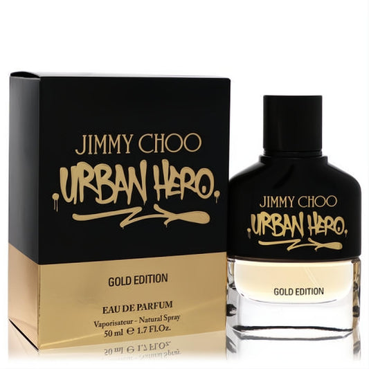Luxurious Jimmy Choo Urban Hero Gold Edition 1.7 oz EDP. Sleek black and gold bottle and box with bold graffiti-style lettering.