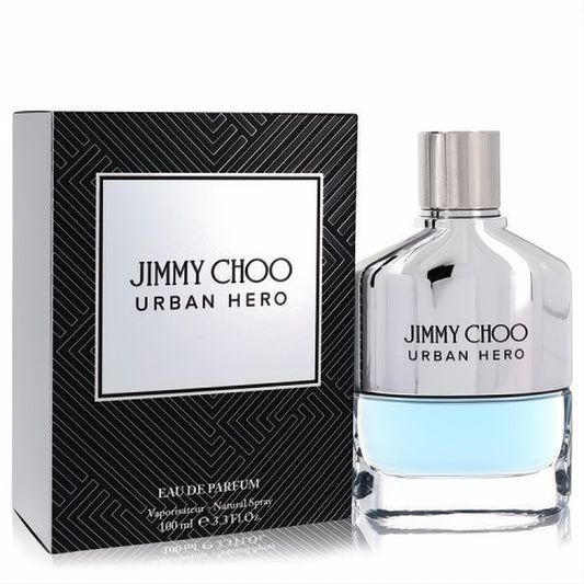 Bold Jimmy Choo Urban Hero 3.3 oz EDP spray. Modern silver and clear glass bottle with refreshing blue liquid, next to its sleek black box.