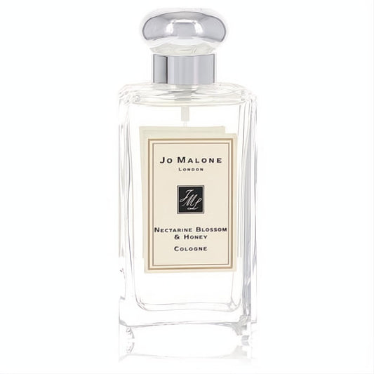 Experience Jo Malone Nectarine Blossom & Honey in its iconic clear glass bottle with a polished silver dome cap.