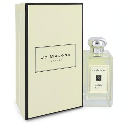 Elegant Jo Malone Orange Blossom 3.4 oz cologne spray in a clear glass bottle with silver cap, beside its chic cream and black branded box.