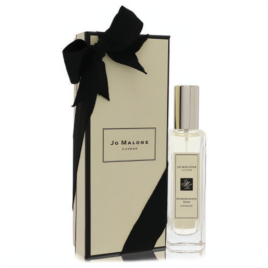 Elegant Jo Malone Pomegranate Noir 1 oz cologne spray in a clear bottle, with its signature cream gift box and black satin bow.