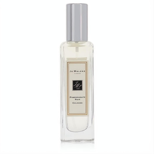 Elegant Jo Malone Pomegranate Noir 1 oz cologne spray. Clear glass bottle, sleek silver cap, and classic cream label.