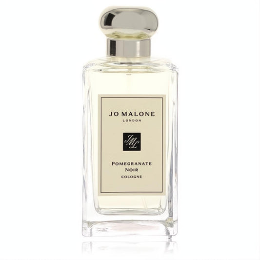 Discover Jo Malone Pomegranate Noir. Elegant clear glass cologne bottle with a sleek silver cap and classic cream label.