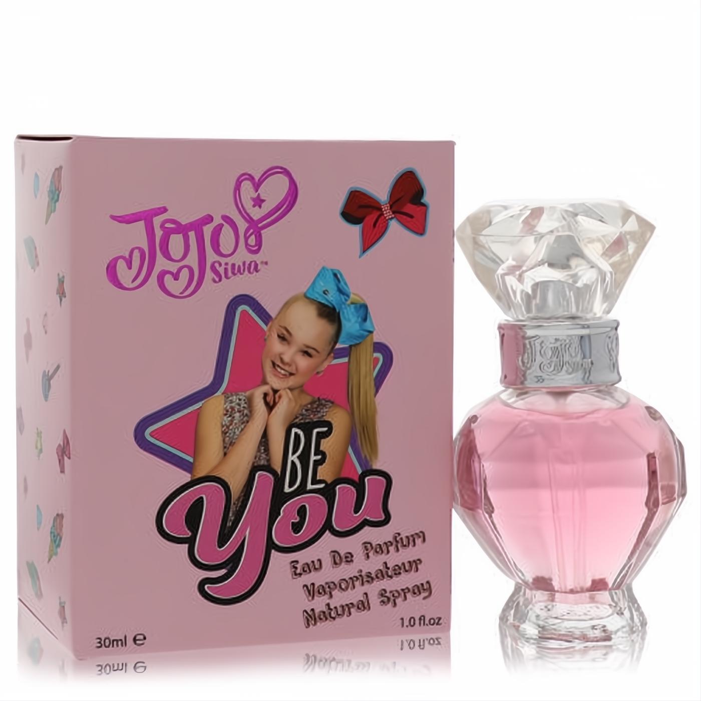 Jojo Siwa Be You 1 oz pink perfume. Faceted glass bottle with a clear diamond cap, next to its vibrant pink box featuring Jojo.