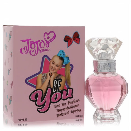 Jojo Siwa Be You 1 oz pink perfume. Faceted glass bottle with a clear diamond cap, next to its vibrant pink box featuring Jojo.