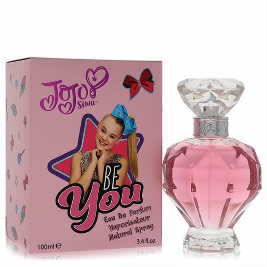 Jojo Siwa Be You 3.4 oz Eau De Parfum: vibrant pink faceted bottle with a sparkling diamond cap and colorful box.