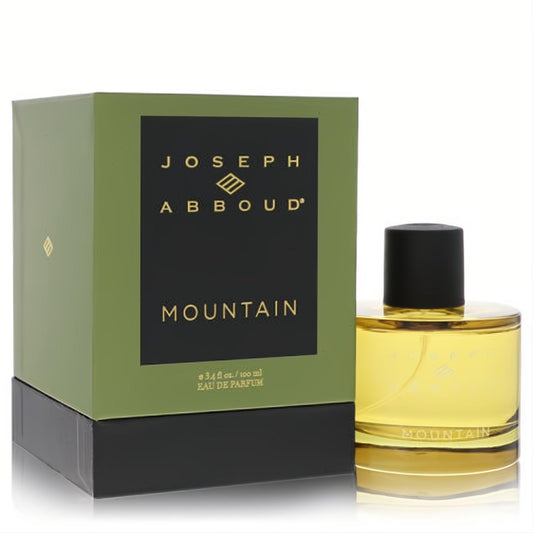 Joseph Abboud Mountain 3.4 oz EDP. Golden liquid in a sleek clear bottle with black cap, beside its signature olive and black box.