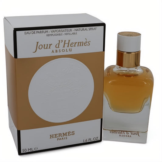 Jour d'Hermes Absolu 1.6 oz women's refillable Eau de Parfum. Golden liquid in a sleek glass bottle, with its elegant white and gold box.