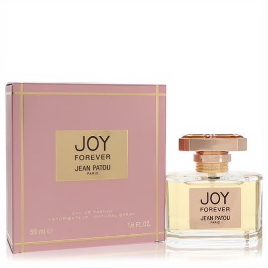 Joy Forever Jean Patou 1.6 oz EDP. Luxurious clear glass bottle with gold cap & light yellow fragrance, beside a chic pink box.